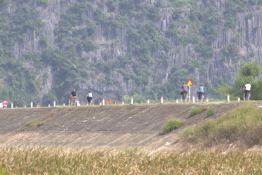 Cycling through villages and along the dikes is a wonderful way to experience the tranquil rhythm of Northern Vietnam
